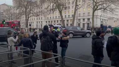 Protesters throw missiles and chase Iraqi PM's car as he leaves Downing Street