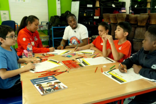 Fergie and Tyrick visit school as part of the No Room for Racism Campaign
